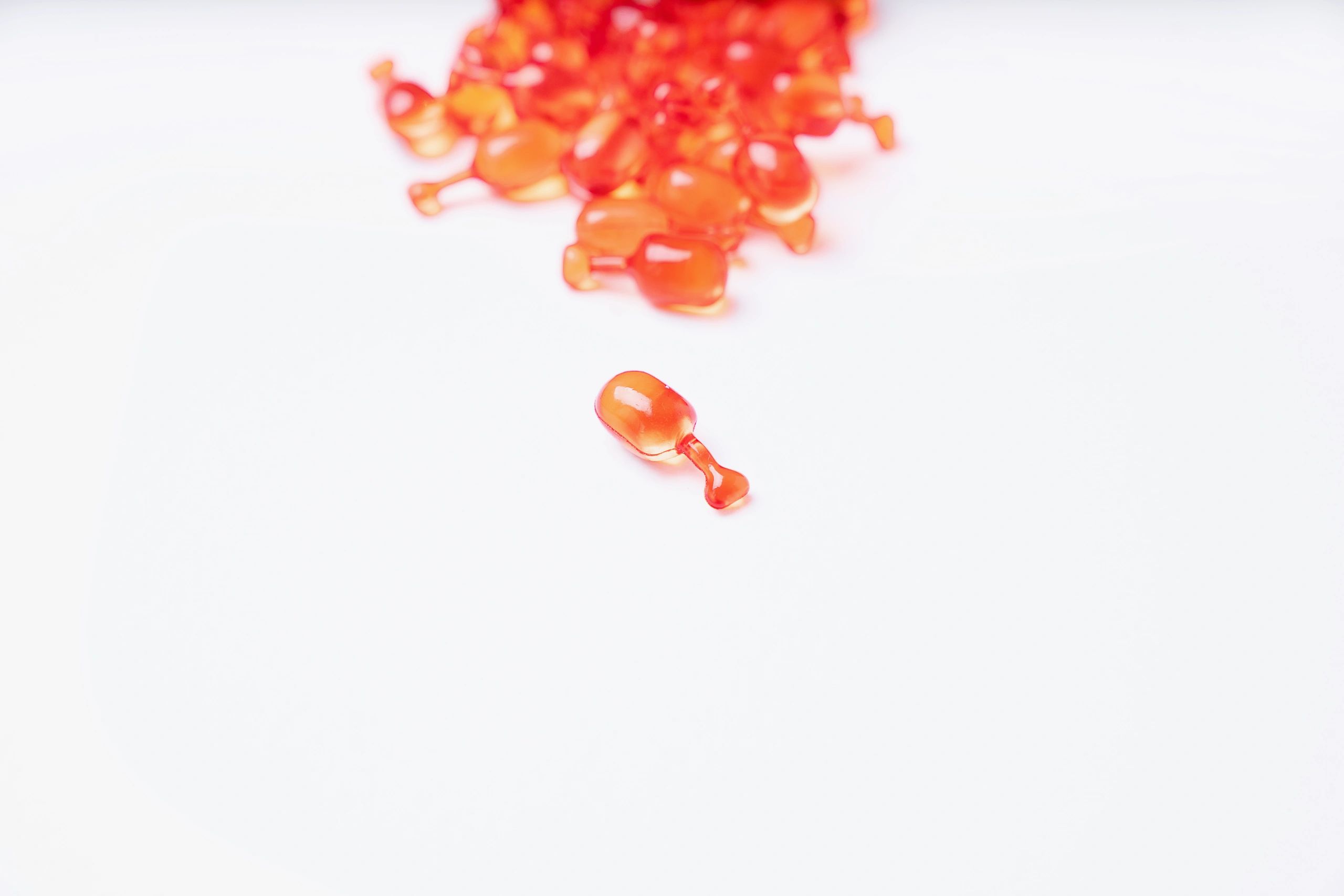Supplement capsules arranged on a clean white background
