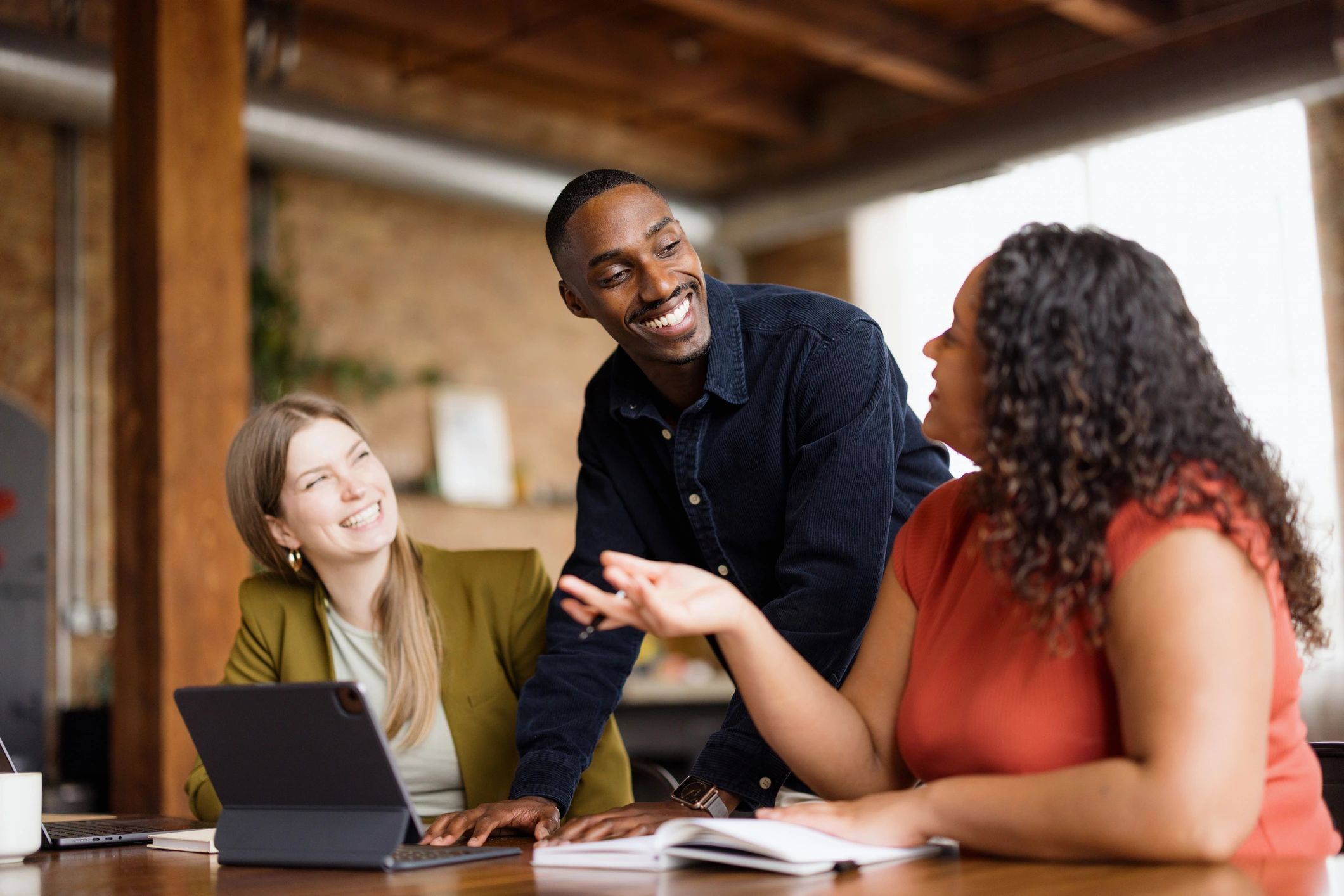 Small wellness team collaborating in a bright office