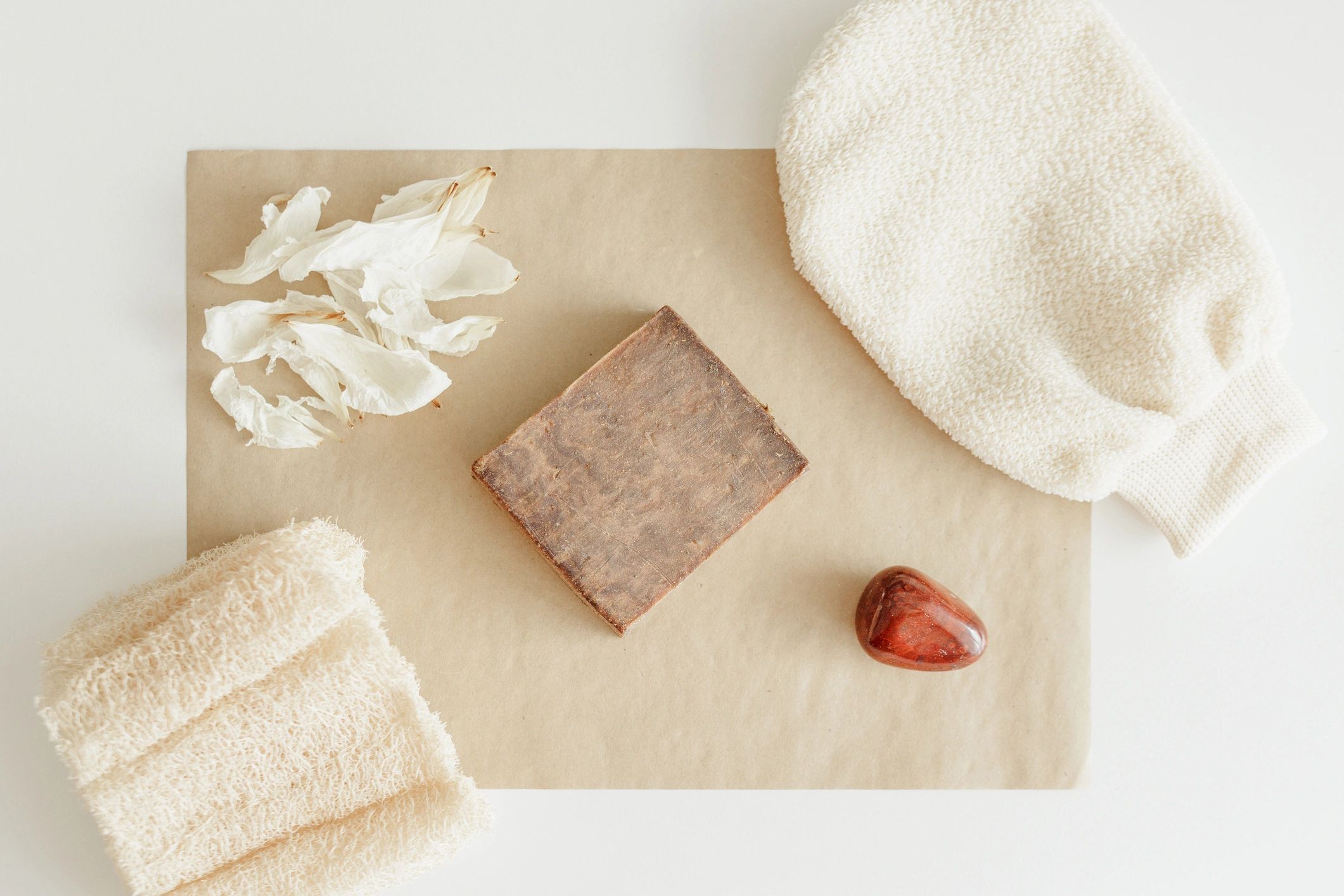 Minimal wellness flat lay with natural products and soft neutral styling
